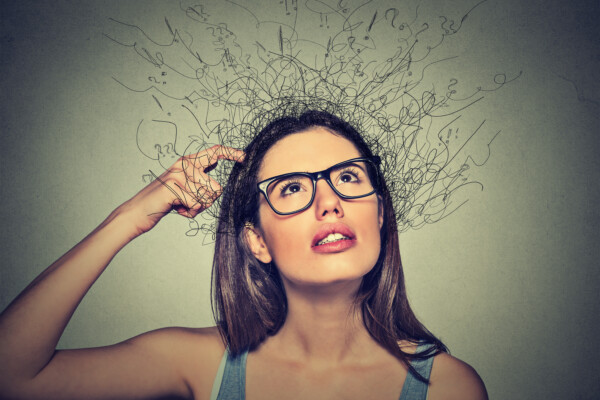 Woman thinking, scratching head, ADHD, ideas, confused, focus