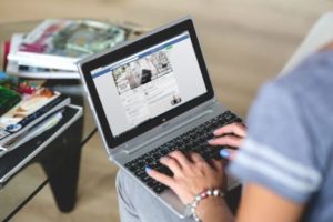 Woman checking Facebook