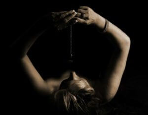 Woman attempting self-hypnosis