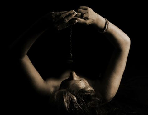 Woman attempting self-hypnosis