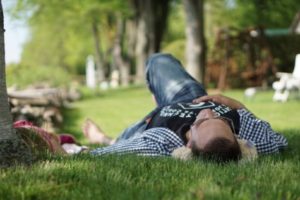 Man taking a nap outside