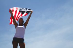 Woman holding an American flag