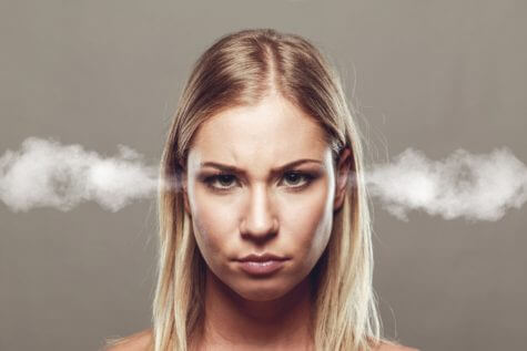 Angry woman with smoke coming from ears