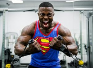Bodybuilder intensely lifting weights at the gym