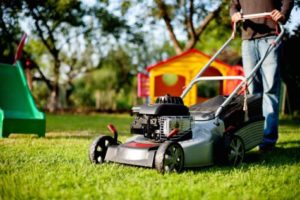 Person using lawn mower