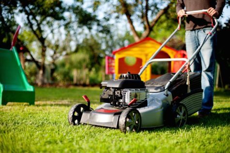 Person using lawn mower