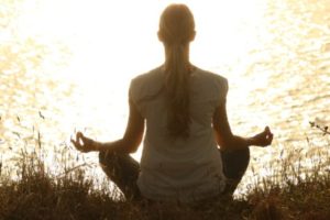 Woman meditating in nature