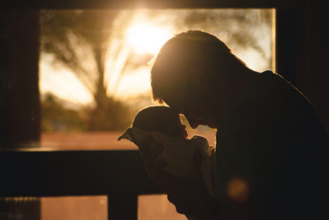 Dad holding a baby