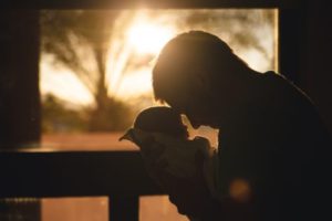 Dad holding infant