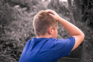 Sad child by himself