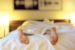Person sleeping in bed