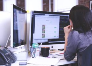 Woman working on computers