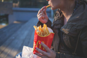 Person eating McDonald's French fries