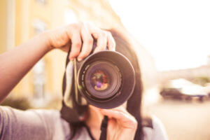 Person taking a photo with a camera