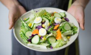 Man holding a salad