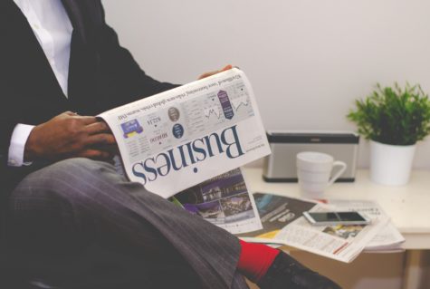 Person reading newspaper