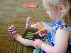 Toddler reading a book