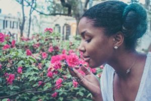 Woman smelling a flower