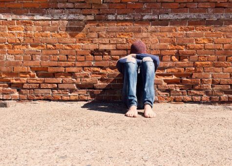 Young person crying alone