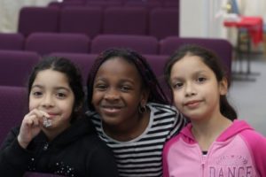 Young girls posing in school
