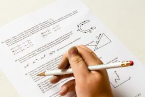 Student doing homework, taking exam