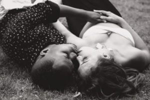 Couple kissing on ground