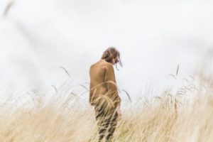 Person alone in a field
