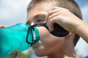 Boy drinking ice water