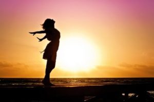 Woman alone at sunset