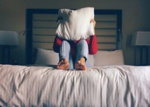 Person in bed who can't sleep