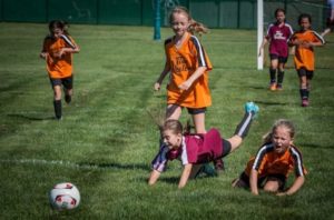 Young girls playing soccer