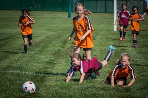 Young girls playing soccer