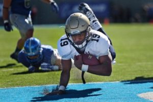 Football player scoring a touchdown