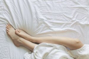 Person laying in bed