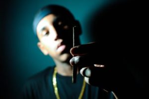 Man holding marijuana joint