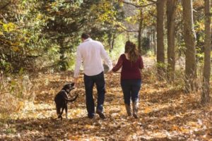 Couple walking their dog