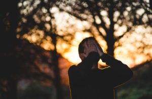 Stressed or frustrated man with hands on face