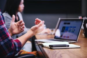 Person using hand gestures while talking