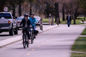 People riding bikes in a park