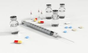 Needle and pills