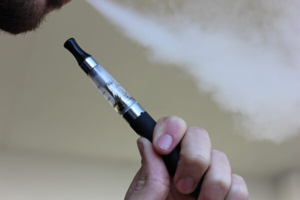 Man vaping with e-cigarette