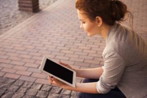 Woman looking at tablet
