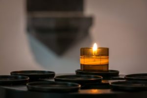 Candle burning in church
