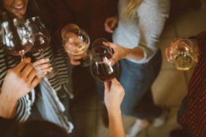 Women toasting with glasses of wine