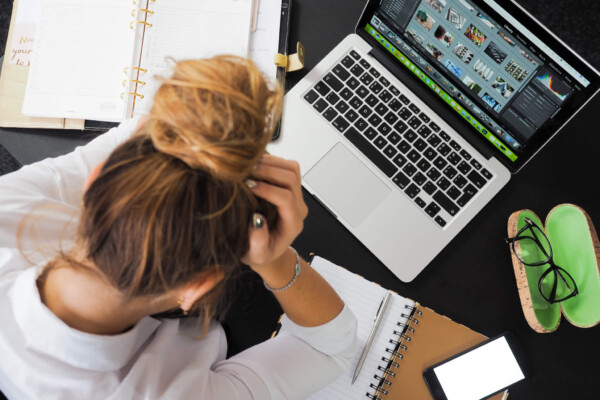 Stressed employee at office desk