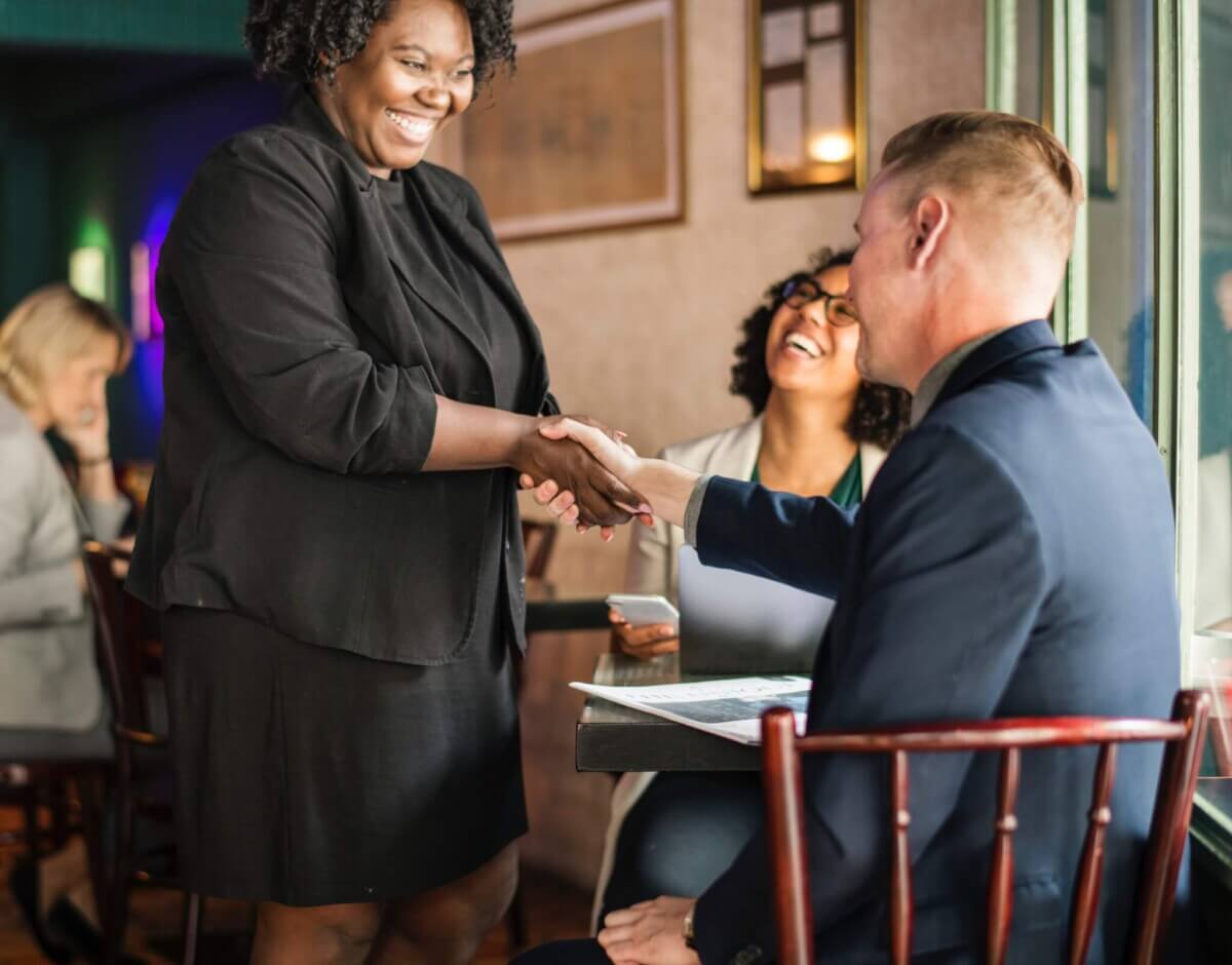 businessman-businesswoman-cafe-1188969