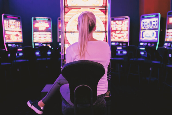 Woman in front of slot machine