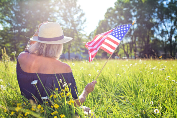 Woman holding American flag