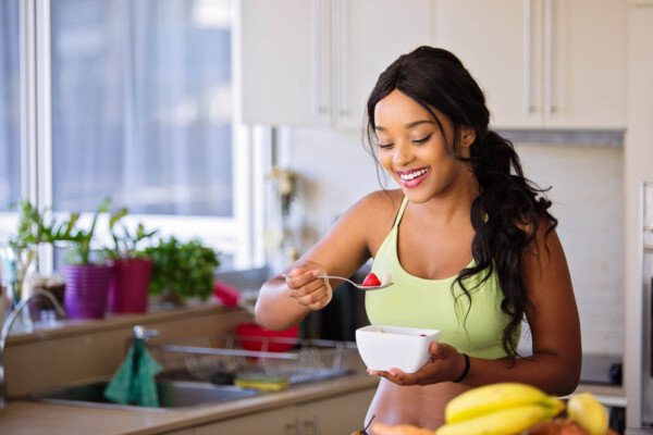 Woman eating fruit