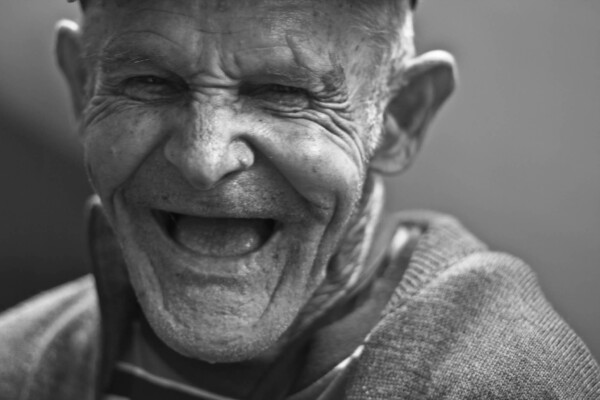 Elderly man laughing